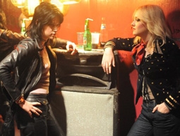 Kristen Stewart as Joan Jett & Dakota Fanning as Cherie Currie in The Runaways