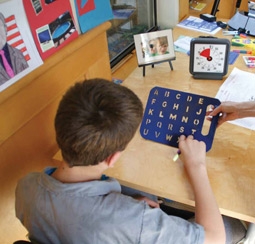 Keli Thorsteinsson Using His Letter Board to Communicate