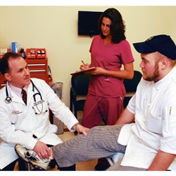 Dr Lamelas & staff check patient at MD Now Urgent Care Workers Comp Injury Management Program Image