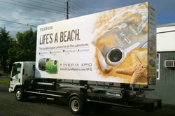 Mobile Billboard Trucks Elevates Their Signs Up to 17 Feet High