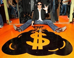 Gene Simmons Celebrating His MoneyBag Logo