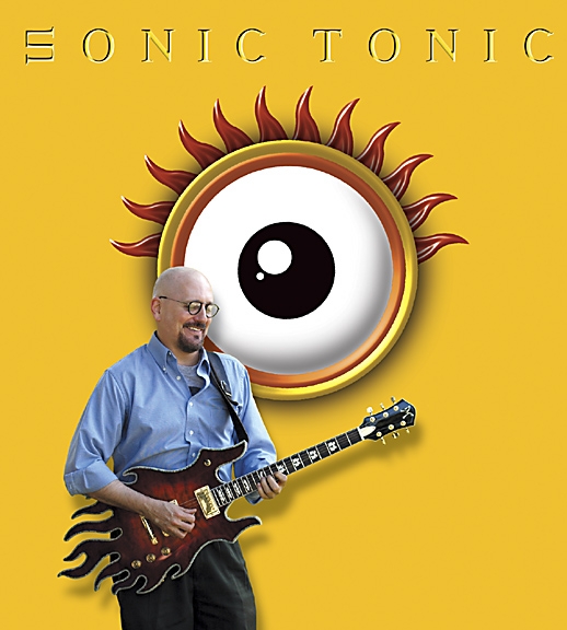 Scott G (The G-Man) in front of a billboard for his SONIC TONIC album. Image