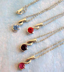 wholesale silver chain necklaces with twisted strip holding a rounded cz stone pendant