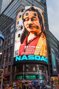 Cover of Shine On Hollywood Magazine with portrait of Artist Cao Yong on the NASDAQ Building in Times Square, New York