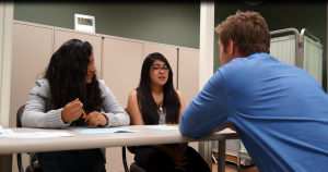 Jennifer Mauricio and Karla Garcia discuss college and career plans with Joel Thomas