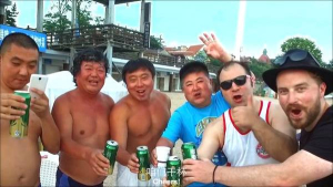 Screenshot from the Love Qingdao Music Video at Qingdao Muscle Beach Liges Squad, JD, and Rueben
