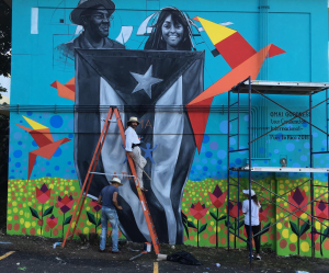 Alexey Steele, Ernesto Rios Rocha and Areli Ribero completing the "Love My Neighbor" - "Ama A Tu Vecino" mural in Cayey, Puerto Rico.