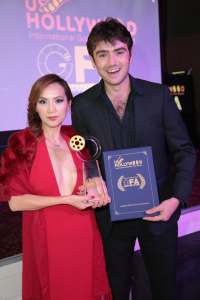 Lily Lisa holding awards