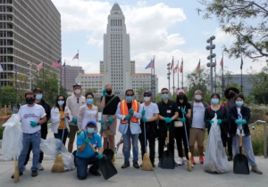 Volunteers clean streets at Los Angeles City Hall's Grand Park