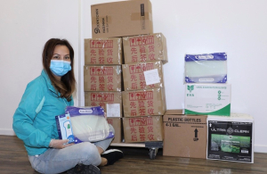 Lily Lisa with one of the first donations for the community at beginning of pandemic