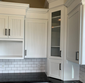 Cabinet painting, tile installation, trim carpentry