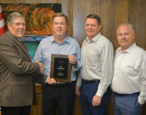 Ron McArthur, John Gassman, and Richard Staples receiving Builder of the Year Award for McArthur Homes