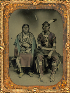 Scarce hand-tinted tintype of an Osage couple, circa 1870s.