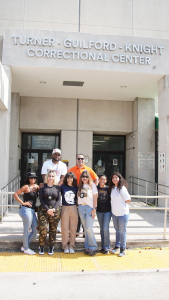 Group photo outside of TGK Correctional Facility-Miami, FL