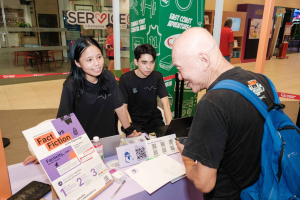 seer.'s information table being visited by citizens