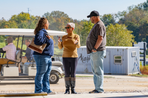 Lucy Hughes with guests at Woods Fort's Open House