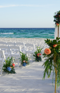 Coastal Ceremony Setup with Lush Floral Aisle Decor