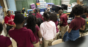 Woodlawn Community Elementary School students and A New Day Foundation Program Coordinator Charles Webb.