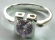 Open-square pattern central design sterling silver ring with rounded light purple cz embedded in mid