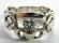 Claddagh sterling silver ring with hand-holding-heart decor in middle and knot work onsides