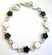 Multi enamel black and white flower pattern forming fashion bracelet, with toggle jewelry clasp for