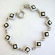 Multi enamel black and white diamond pattern forming fashion bracelet, with toggle jewelry clasp for