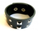 Fashion bracelet in black wide imitation leather band design with multi faceted square and mini star