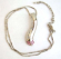 Fashion necklace with beaded chain holding a multi mini pinkish cz bottom