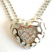 Fashion necklace with double beaded chains holding a multi mini clear cz embedded, carved-out patter