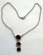 Fashion chain necklace with chain-in triple reddish circle pendant at center