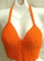 Orange crochet top with swirl cup and bottom design in fan pattern