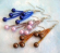 Fashion fish hook earring with triple cylinder beaded strips holding triple imitation pearl beads on