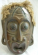Black tribal man wooden mask with rope hair and large eyes and mouth