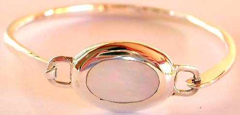 Fantasy jewelry design - Sterling silver bangle with elliptical shape white mother of pearl seashell
