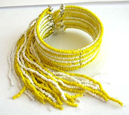 Fashion bracelet bangle in multi yellow and white beaded strings design with multi beaded string dan