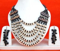 Black and white multilayered bone necklace with additional earrings